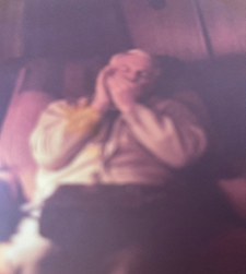 Don playing the harmonica